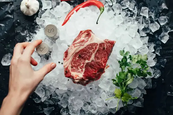 raw steak on ice